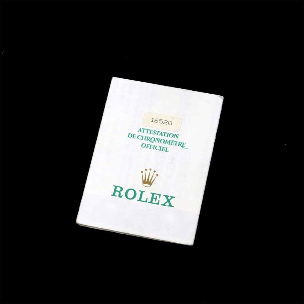 Certificat de chronomètre officiel Rolex (COSC) avec étiquette '16520', document papier blanc à texte vert et logo couronne Rolex